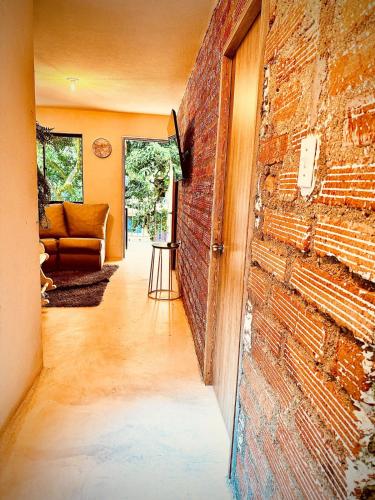 a room with a brick wall and a door at The best of Envigado, close to everything in Envigado