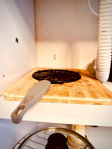 a stove with a knife on a cutting board at The best of Envigado, close to everything in Envigado