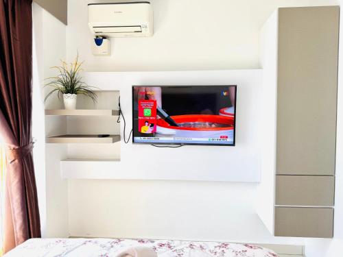 Hejmo Suitesにあるテレビまたはエンターテインメントセンター