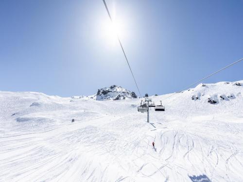 a ski lift on top of a snow covered mountain at Apartment in Fügen near Spieljoch Ski Lift in Fügen