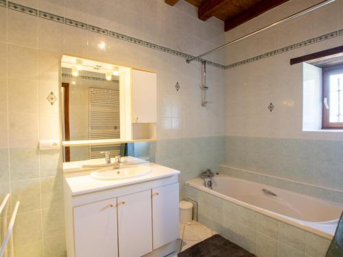a bathroom with a sink and a bath tub at Charmante maison Perigord avec parking et cheminée - Saint-Avit-Rivière - FR-1-616-180 in Saint-Avit-Rivière