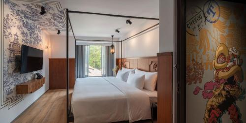 Postel nebo postele na pokoji v ubytování PASSA Hotel Bangkok