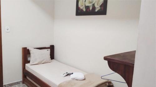 Ένα ή περισσότερα κρεβάτια σε δωμάτιο στο Hotel pousada estação dos devotos