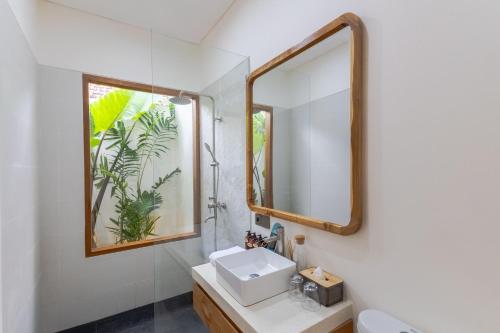 a bathroom with a sink and a mirror at Villa Maria-2BR Private Villa in Canggu in Kerobokan
