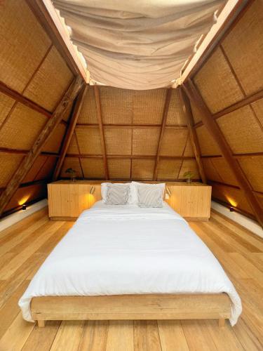 a large bed in a room in a yurt at Julita Boutique Villas in Burgos
