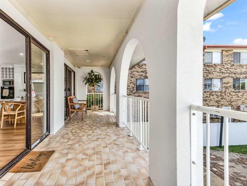 a balcony with a view of a house at Upper Lvl Boyd-3 Bedroom Sunny Coastal in Tweed Heads