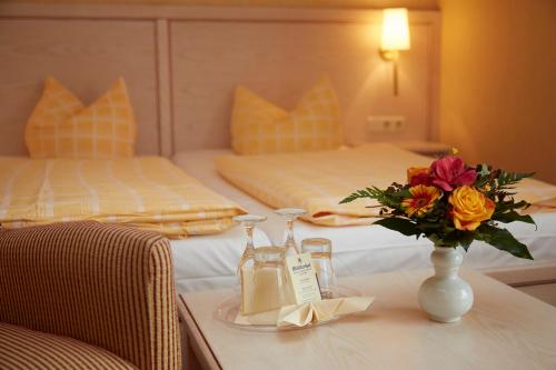 מיטה או מיטות בחדר ב-Bed & Breakfast Hotel Müllerhof