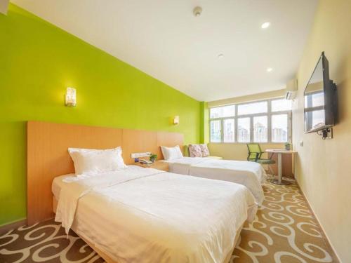 Postel nebo postele na pokoji v ubytování Guangxin Hotel Shenzhen