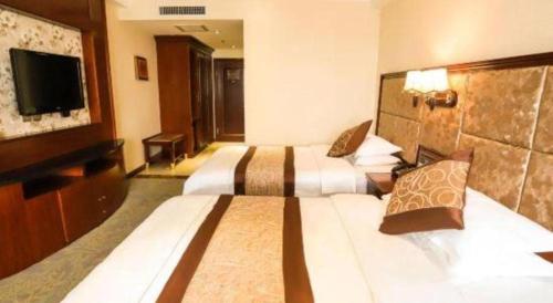 Katil atau katil-katil dalam bilik di Changchun Global Hotel