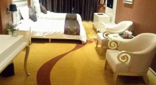 Ένα ή περισσότερα κρεβάτια σε δωμάτιο στο Metropark Hotel