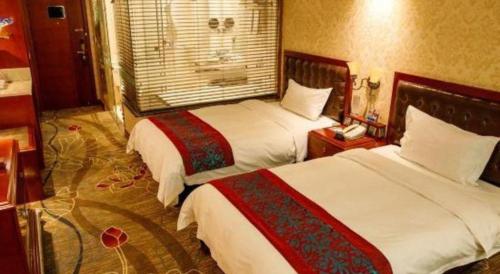Ένα ή περισσότερα κρεβάτια σε δωμάτιο στο Metropark Hotel