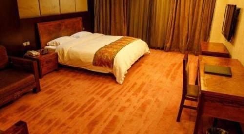 Ένα ή περισσότερα κρεβάτια σε δωμάτιο στο Metropark Hotel