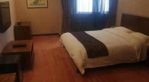 Ένα ή περισσότερα κρεβάτια σε δωμάτιο στο Metropark Hotel