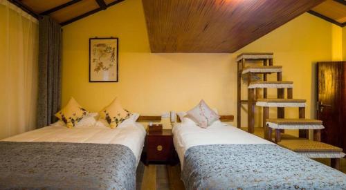 Ένα ή περισσότερα κρεβάτια σε δωμάτιο στο The Courtyard Suzhou Inn Hemu Branch