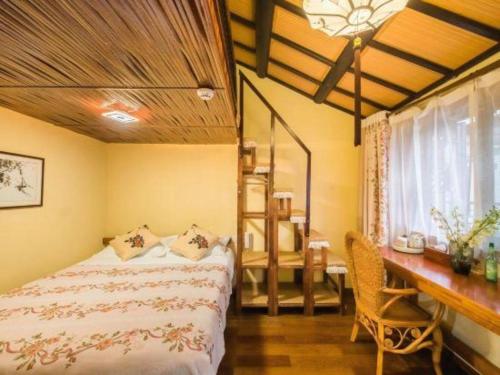 Ένα ή περισσότερα κρεβάτια σε δωμάτιο στο The Courtyard Suzhou Inn Hemu Branch