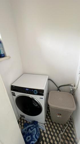 a microwave oven sitting in a corner of a room at TENNIS LIFE ŠUMPERK in Šumperk