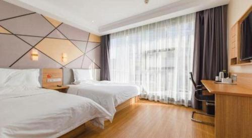 Ένα ή περισσότερα κρεβάτια σε δωμάτιο στο 7 Days Premium Qingdao World of Ocean Qingdao University