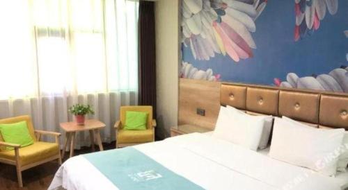 Ένα ή περισσότερα κρεβάτια σε δωμάτιο στο PAI Hotel·Linfen Hongdong Lily Town