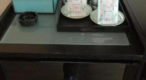 a table with two plates and a bowl on it at Xana Hotelle·Tianshui Shangyi Plaza in Tianshui