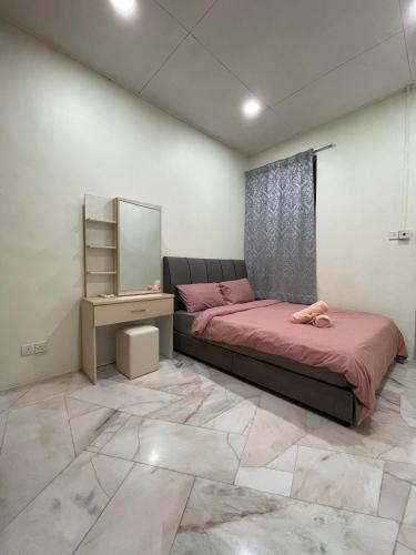 Ένα ή περισσότερα κρεβάτια σε δωμάτιο στο Garden Homes Simple Seremban 2