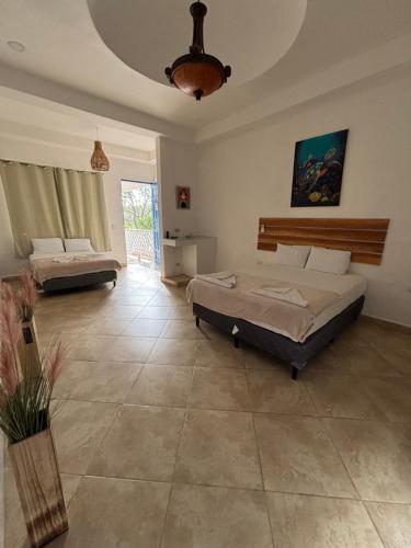 Postel nebo postele na pokoji v ubytování Hotel Remanso Beach