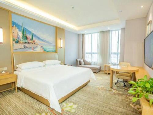 Postel nebo postele na pokoji v ubytování Vienna Hotel Anhui Guangde Development Zone