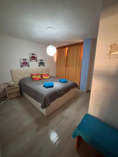 a bedroom with a bed with two pillows on it at Beach Apartment with Ocean View La Arena in Puerto de Santiago