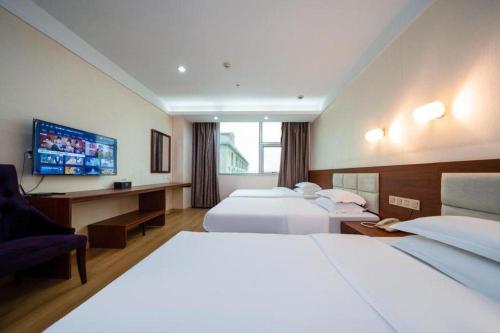 Postel nebo postele na pokoji v ubytování Bashan Hotel