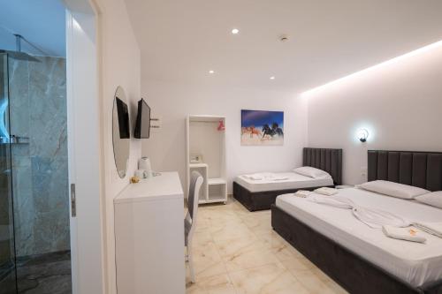 Postel nebo postele na pokoji v ubytování Feniks Hotel