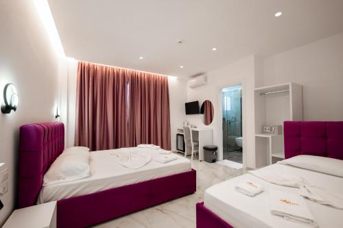 Postel nebo postele na pokoji v ubytování Feniks Hotel