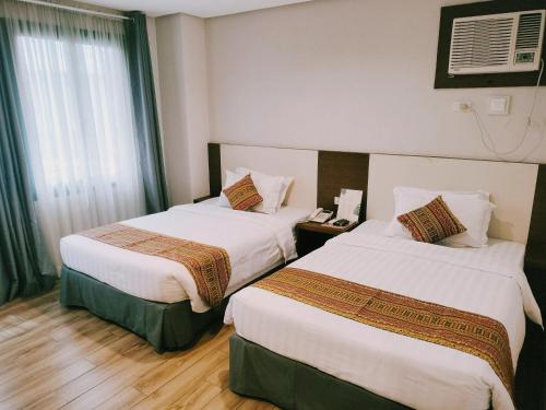 The Lanang Suitesにあるベッド
