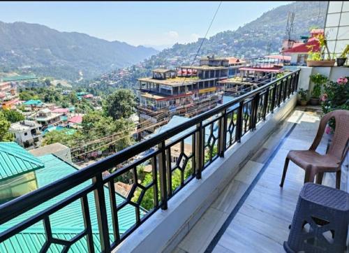 a balcony with a view of a city at Family Suite Homestay in Solan