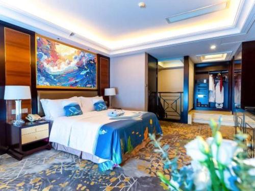 a bedroom with a bed with a painting on the wall at Royal Tulip Hotel Zhujiajiao Shanghai in Shanghai