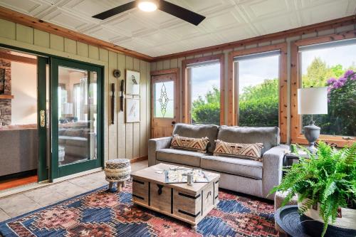 a living room with a couch and a coffee table at A Hikers Dream - 34 Acres Hot Tub Views Trails in Cosby