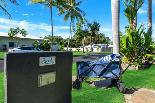 a blue baby stroller next to a mail box at Belle Escapes Villa Riviera in Palm Cove