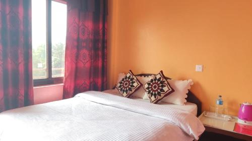 Postel nebo postele na pokoji v ubytování Hotel Pigeon Prince