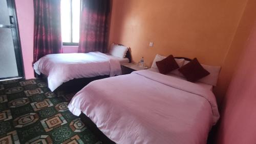 Postel nebo postele na pokoji v ubytování Hotel Pigeon Prince