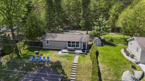 an aerial view of a house with a yard at Beautiful Torch Lake House with Beach Access home in Rapid City