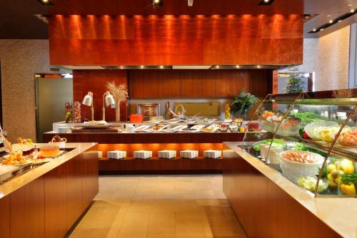 a buffet line in a restaurant with a lot of food at GRAND NIKKO AWAJI in Awaji