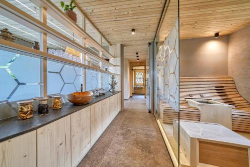 a bathroom with a sink and a large window at Eco Bnb & Apartments Bründlerhof in Marlengo