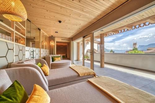 a living room with a view of the city at Eco Bnb & Apartments Bründlerhof in Marlengo