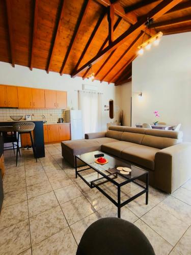 a living room with a couch and a table at Bella Casa in Petrití