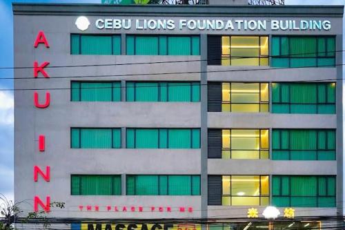 a building with a sign on the side of it at Aku Inn Cebu City in Cebu City