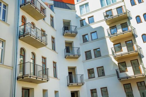 a facade of a building with balconies at Kołłątaja 23 Apartments in Wrocław