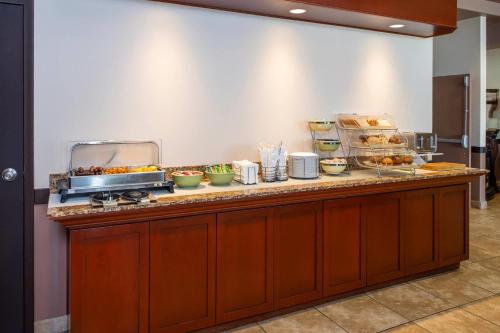 a buffet line with various food items on it at Quality Inn & Suites in Lethbridge