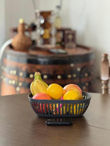 a bowl of fruit sitting on a table at Kuća ispod Rajca in Slavkovica