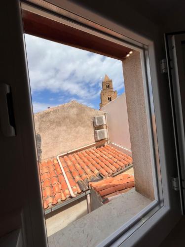 a view from a window of a roof at Oltremare in Cefalù