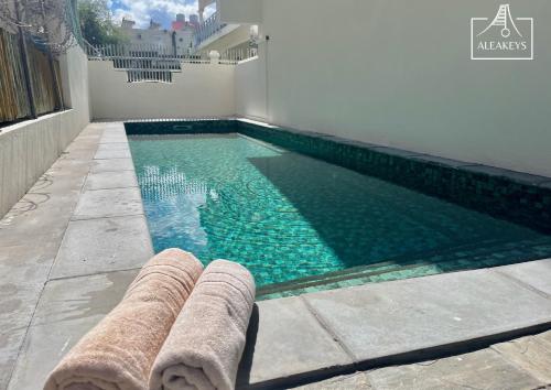 Bazén v ubytování Sunset Apt moderne à 2 min de la plage, clim, piscine nebo v jeho okolí