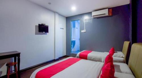 Postel nebo postele na pokoji v ubytování OYO 89895 Senses Budget Hotel