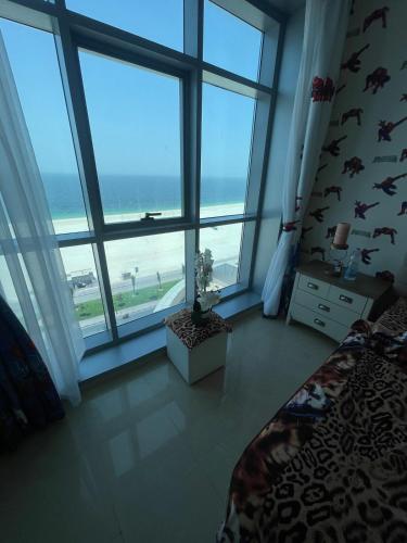 Katil atau katil-katil dalam bilik di Beach view apt pool access